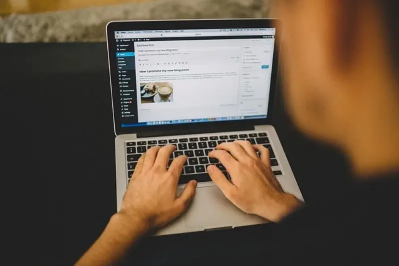 A Man Writing A blog post on Wor