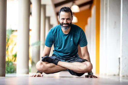 A Man Practising Yoga with Smile